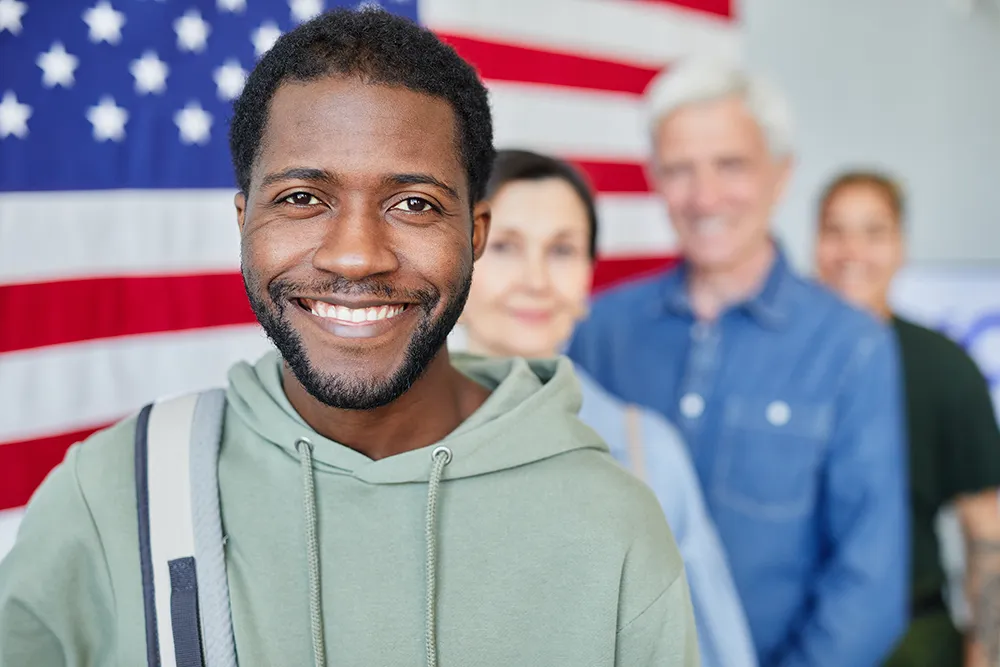 Veteran student smiling with the american flag